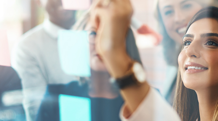 A woman drawing on the board